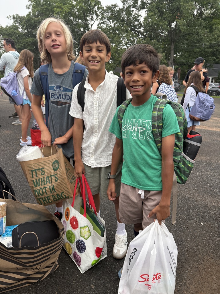 three boys standing during arrival on the first day of school