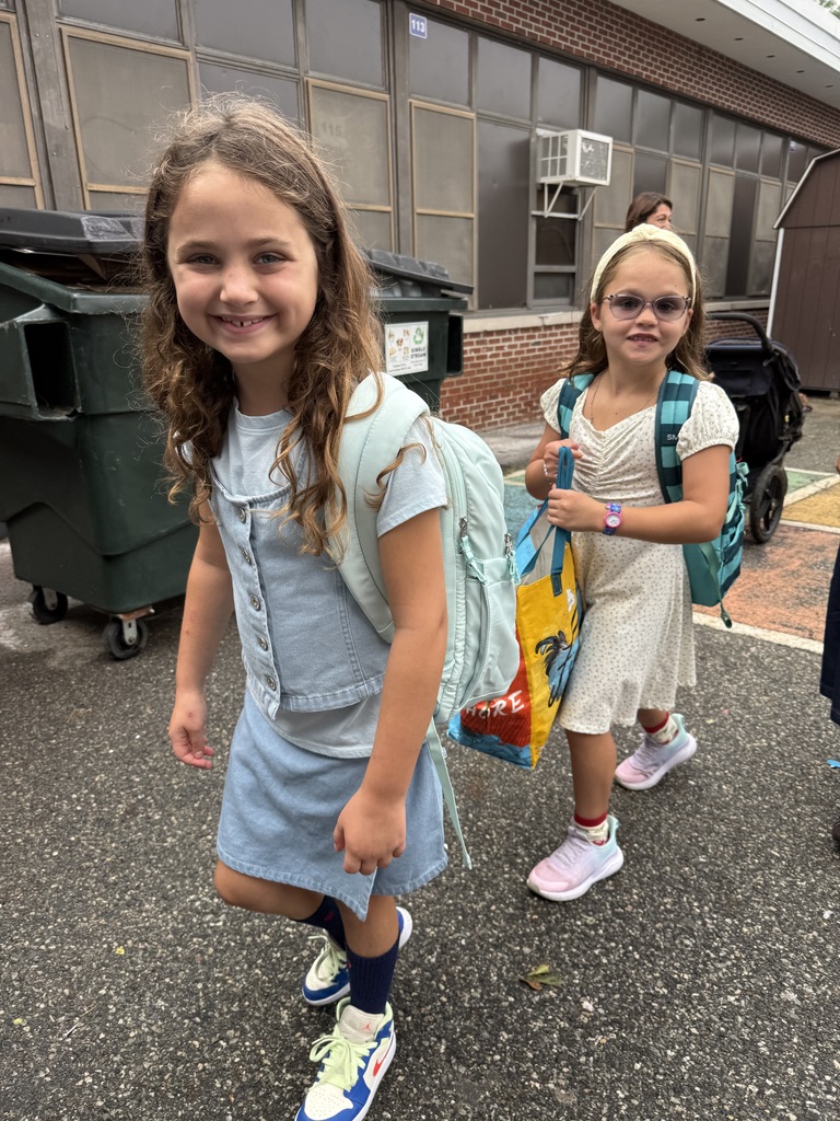 two girls walking in  on the first day of school