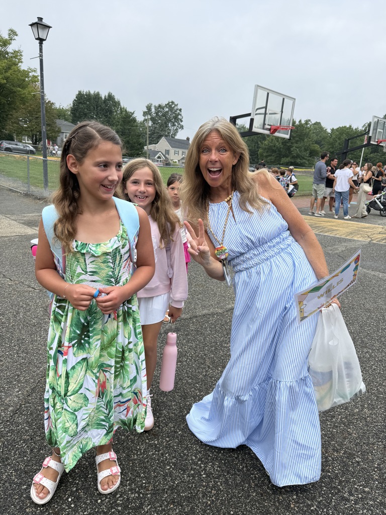 students walking in with their teacher  on the first day of school