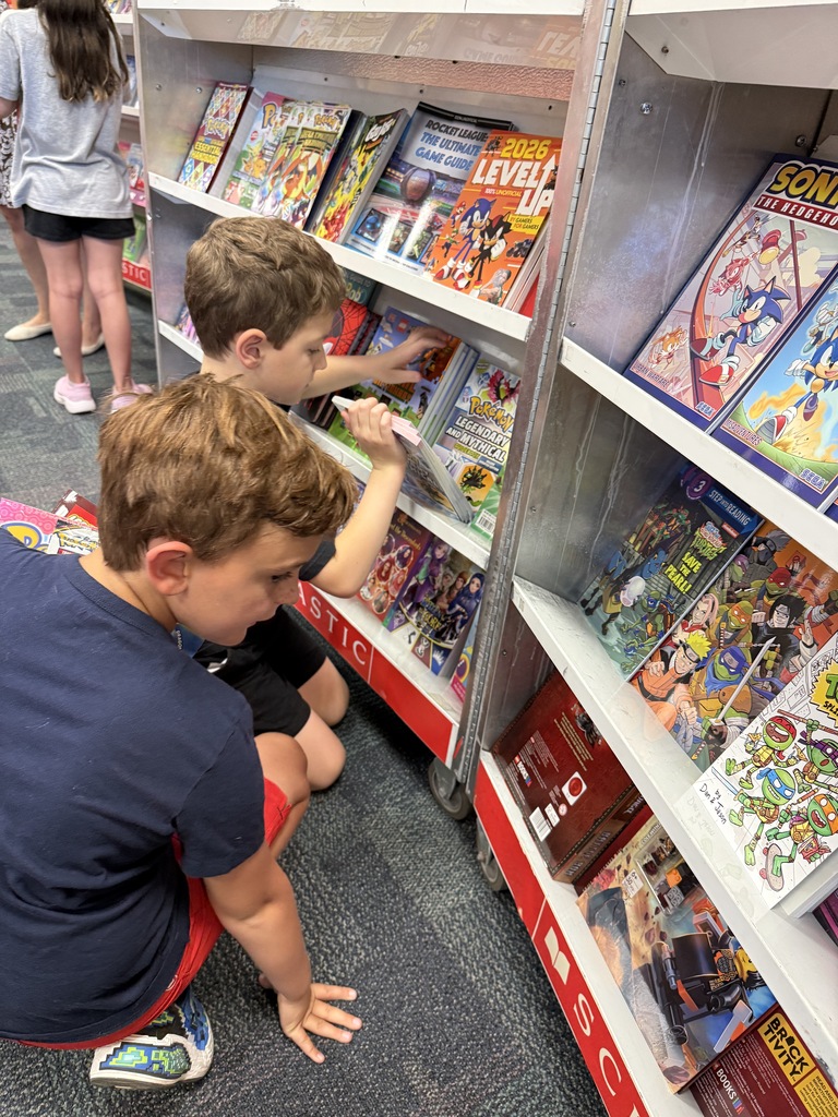 students exploring books at the book fair