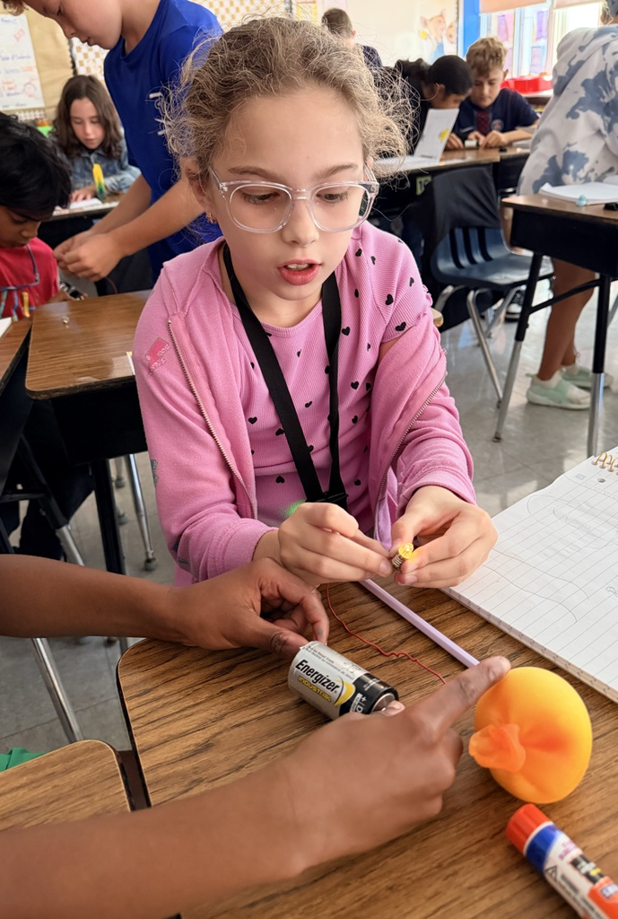 students engage in a science experiment about energy