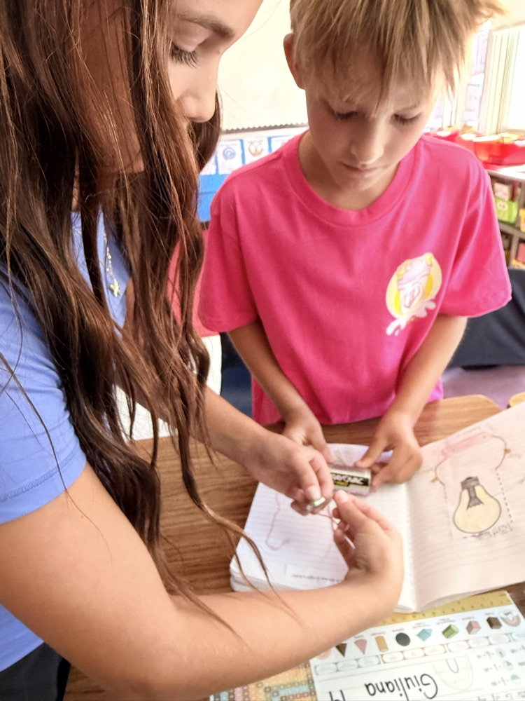 students engage in a science experiment about energy