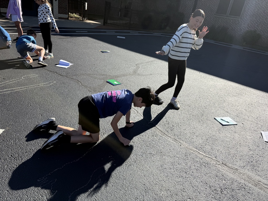 Students tracing shadows