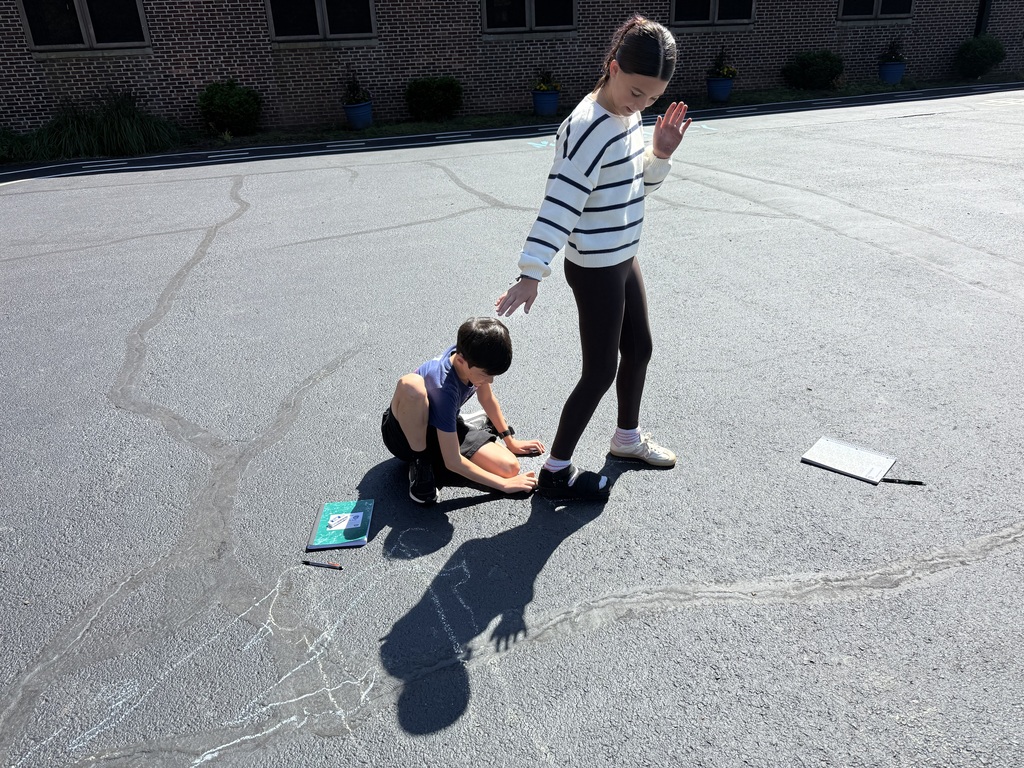 Students tracing shadows