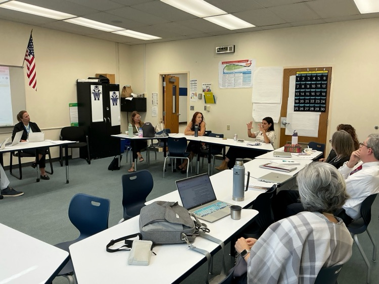 TEachers at a table discussion
