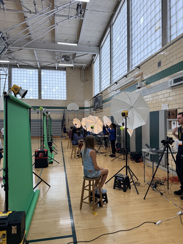 student posing for a photographer
