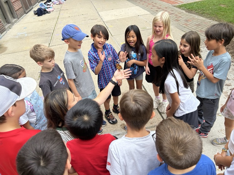 students releasing butterflies