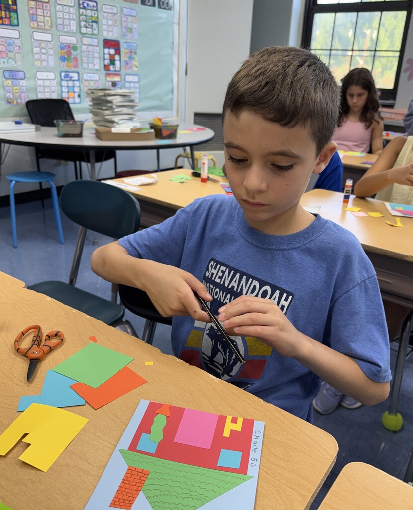 student working on their unique collage house