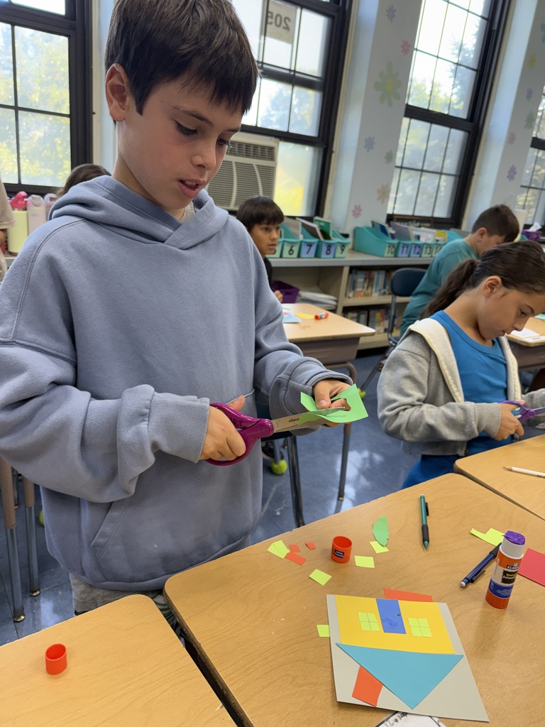 student working on their unique collage house