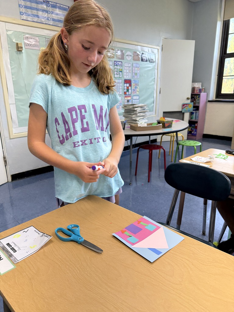 student working on their unique collage house