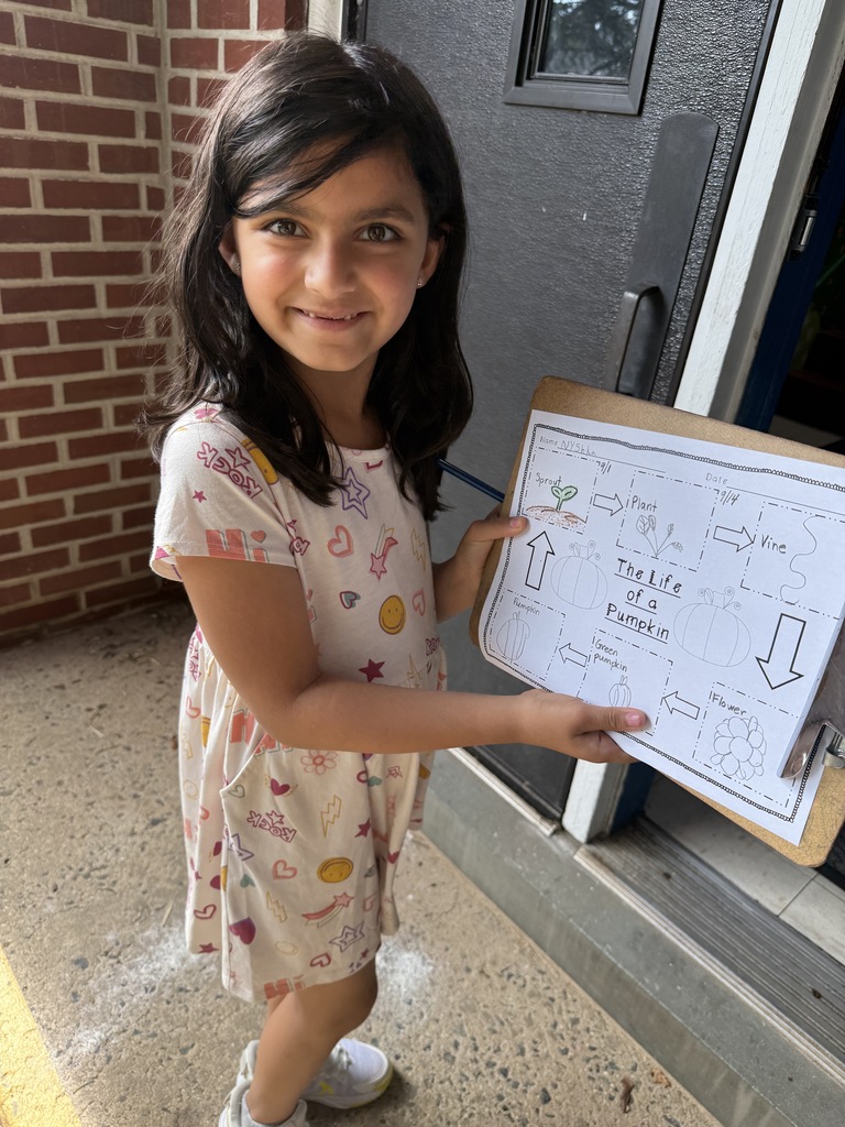 student holding clipboard with observations paper