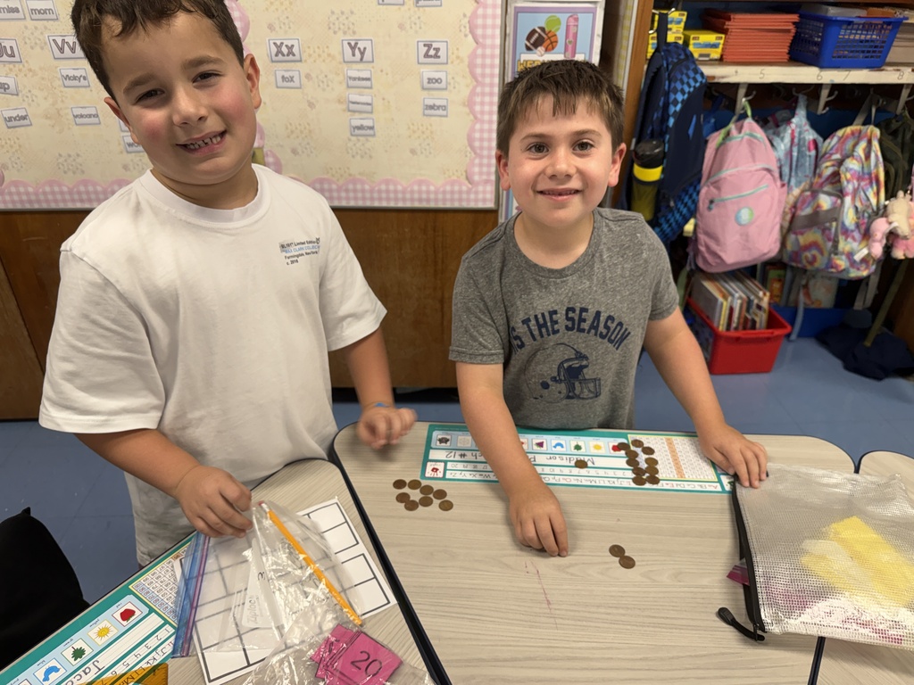 students playing penny dice game at desks