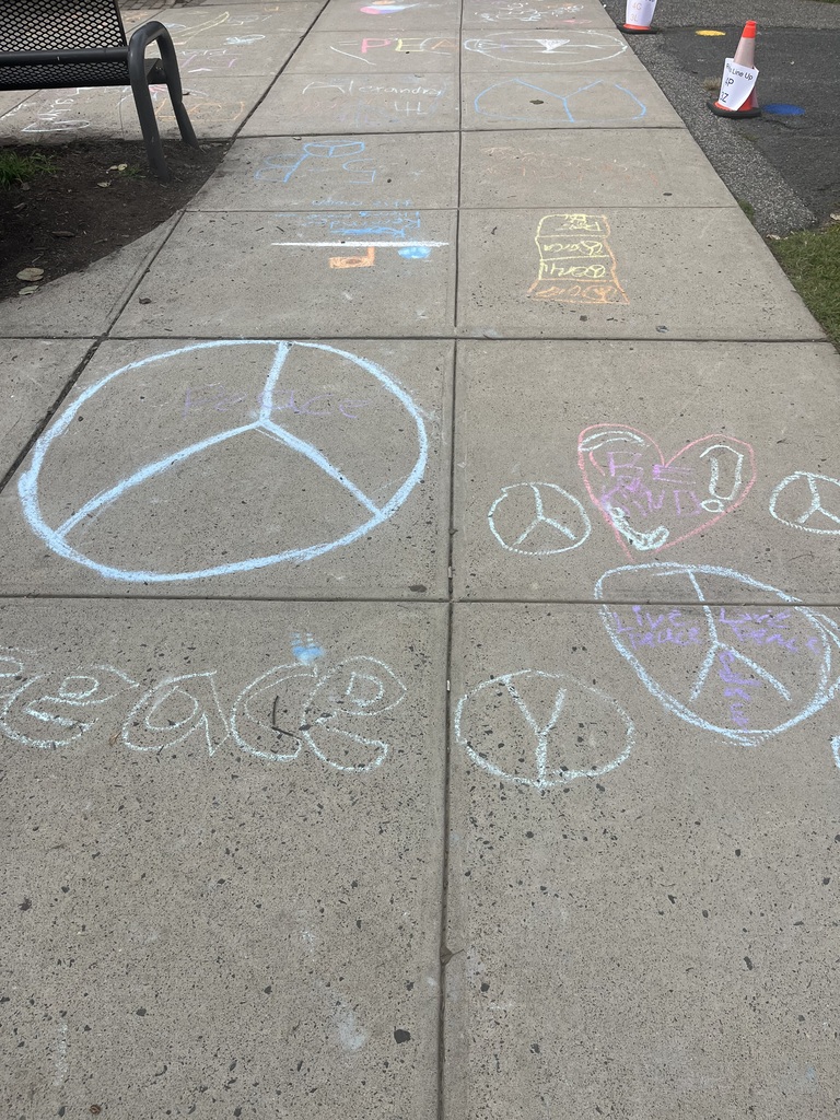 Peace symbols drawn with chalk