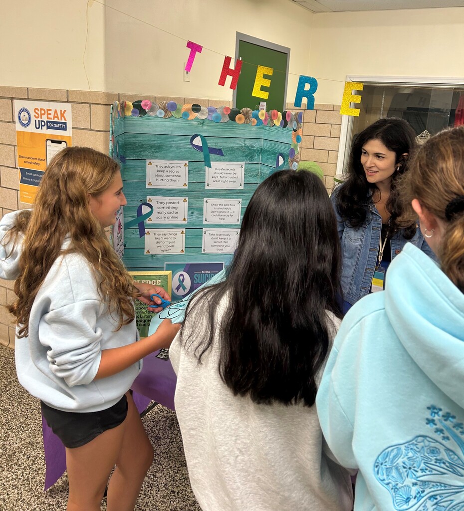 Students filling out ribbons