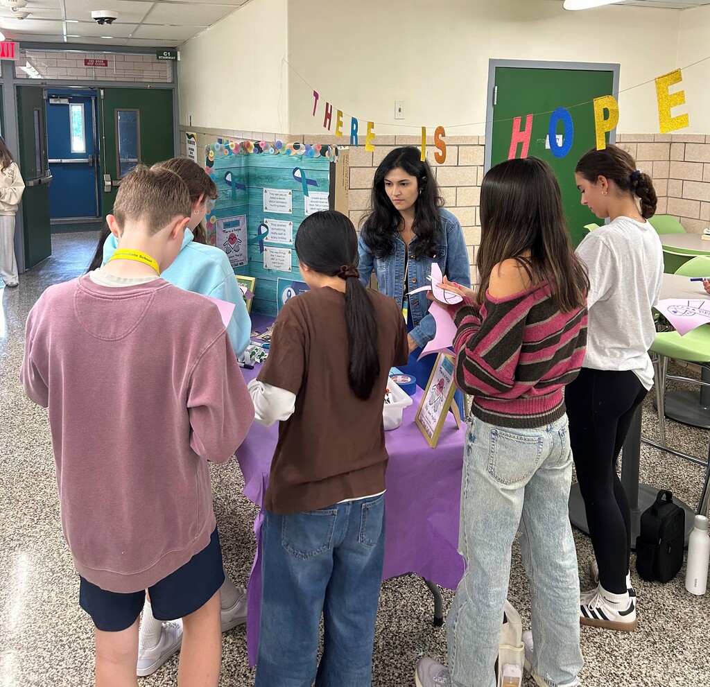 Students filling out ribbons
