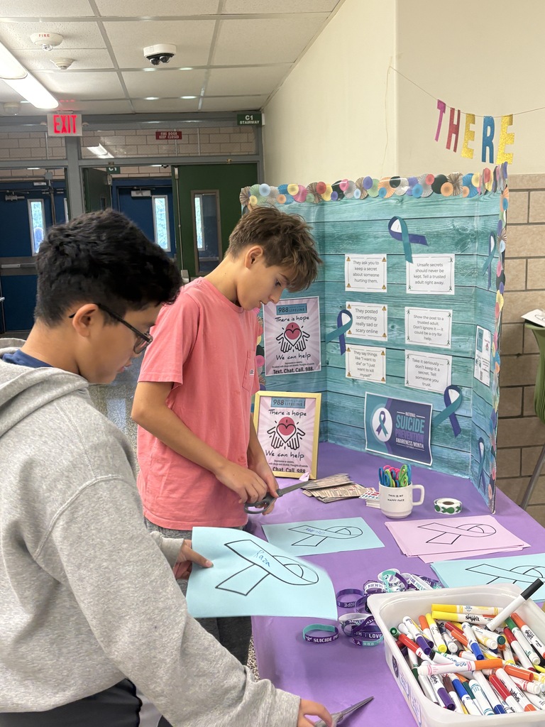 Students filling out ribbons