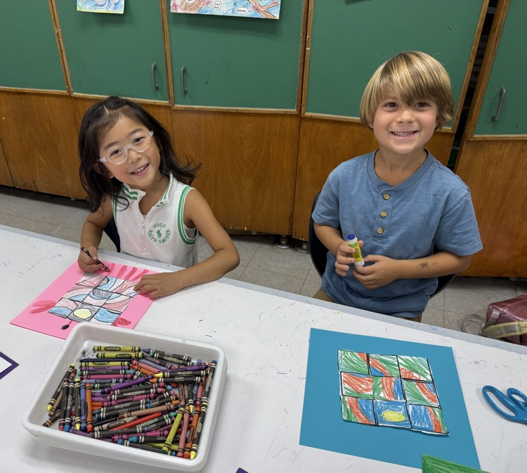 students engage in a first grade art lesson