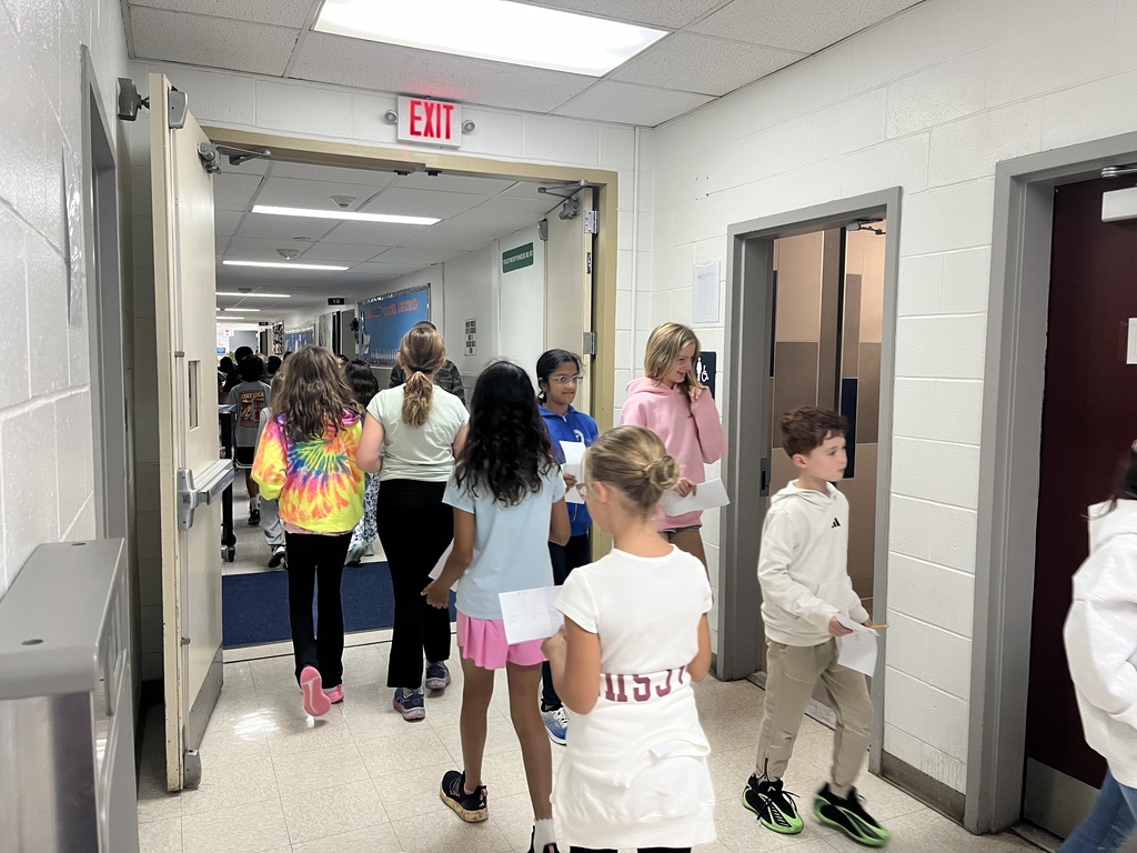 Students walking in the halls to go to the next class.
