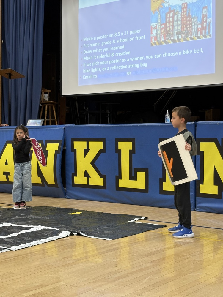 pedestrian safety assembly. students practicing using a crosswalk 