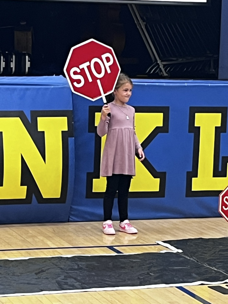 pedestrian safety assembly. students practicing using a crosswalk 