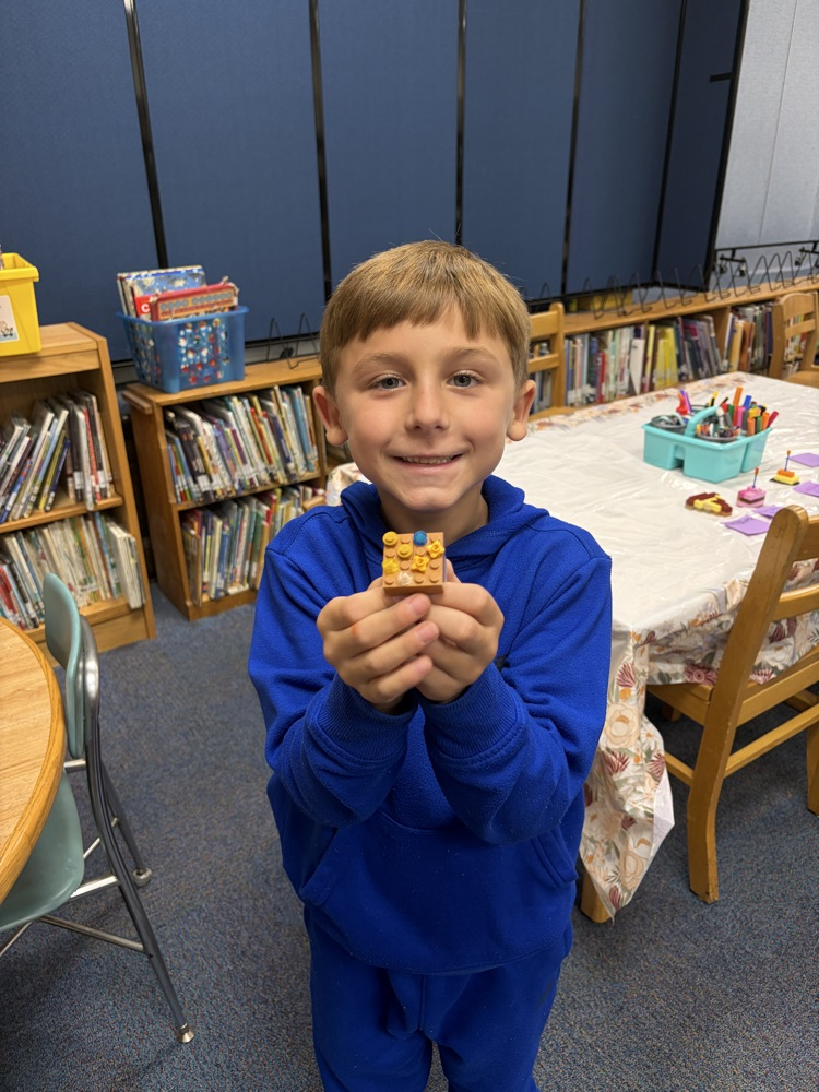 student in Lego building class