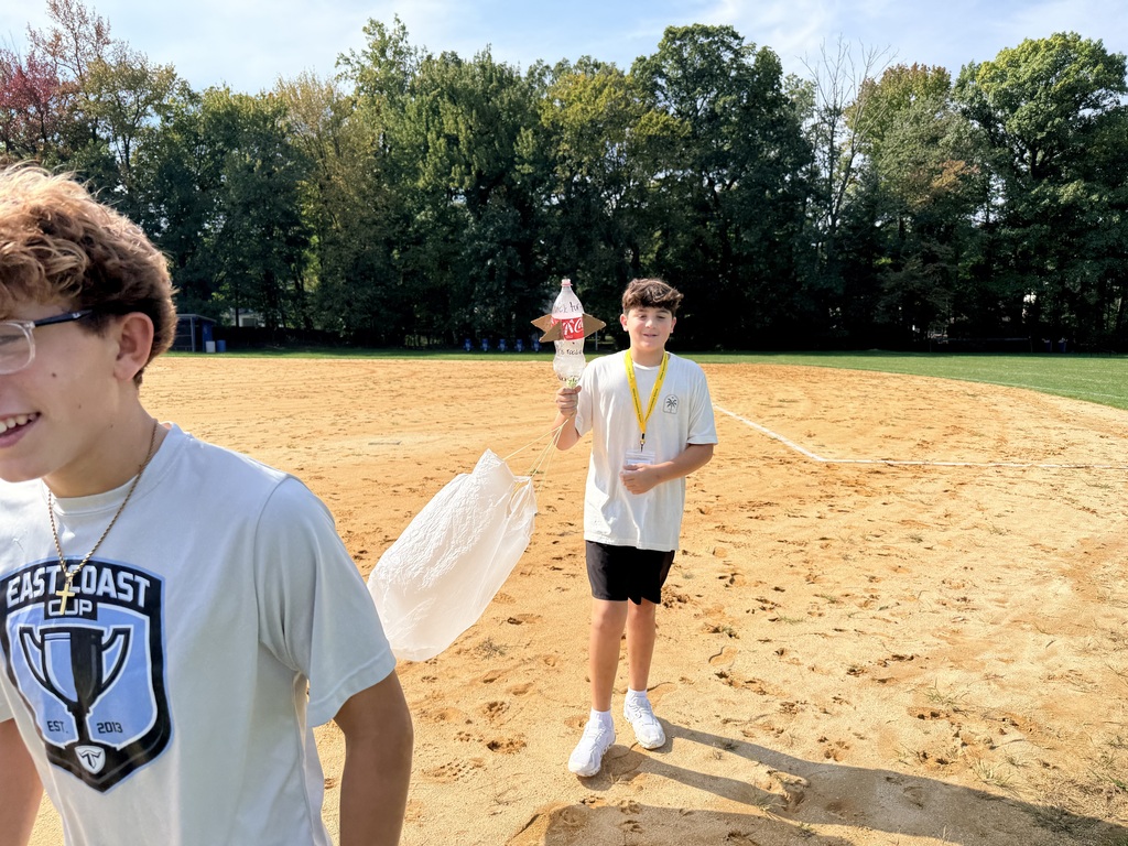 student holding rocket 