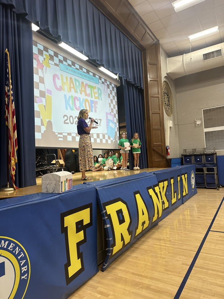 assembly with students and teacher