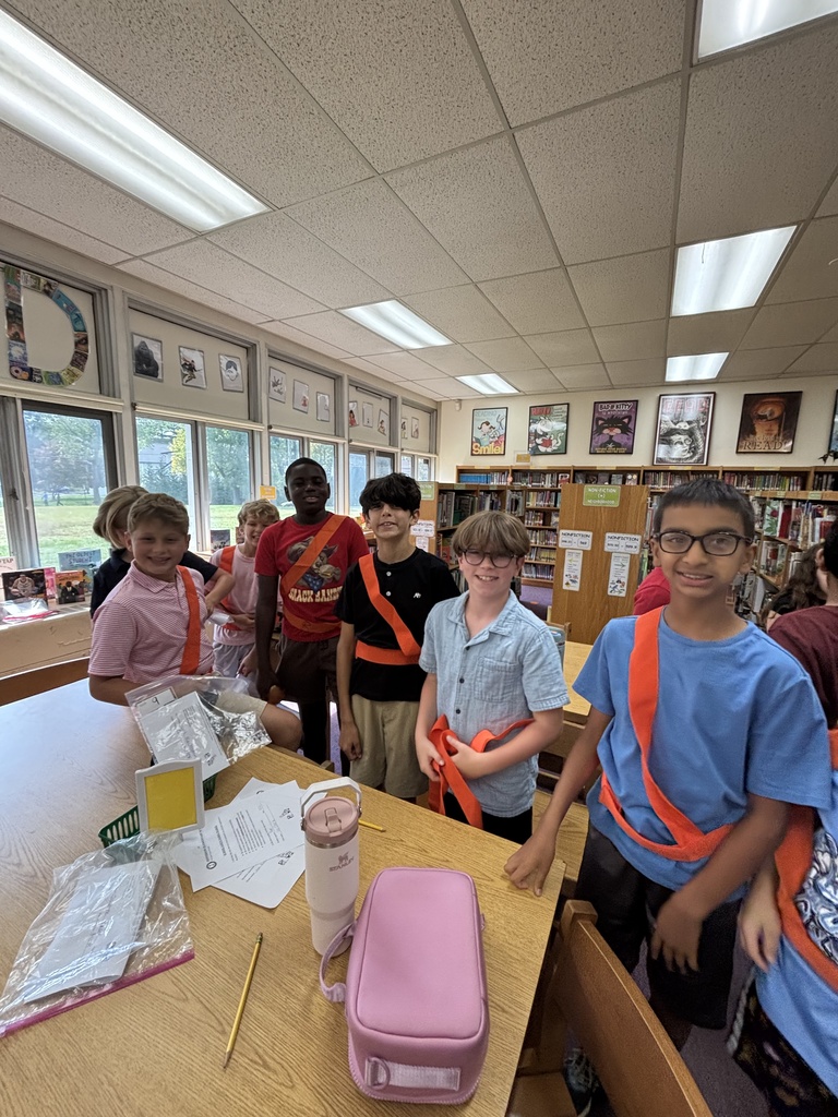 Students proudly wearing their safety patrol belts.