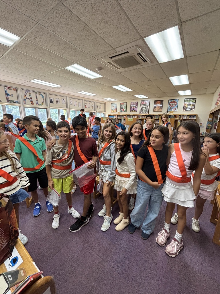 Students proudly wearing their safety patrol belts.
