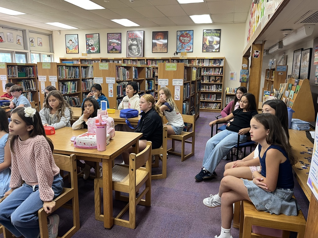 Students listening attentively.