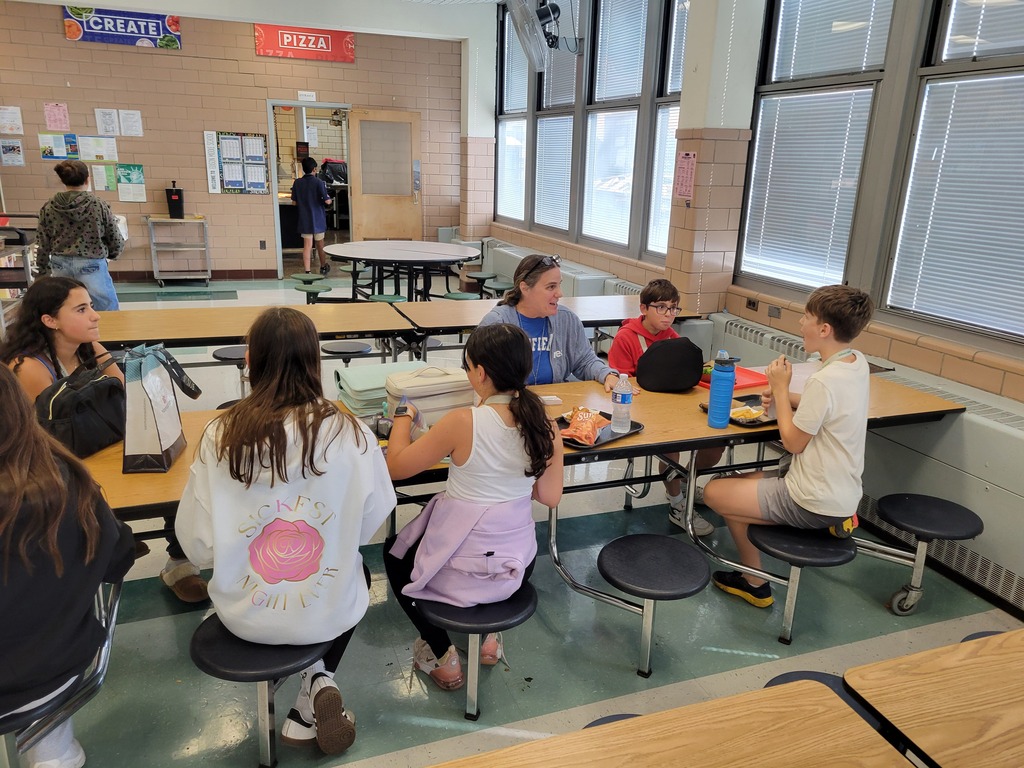 Teacher talking with students