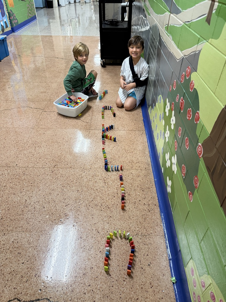 two bots making the name franklin with dominoes 