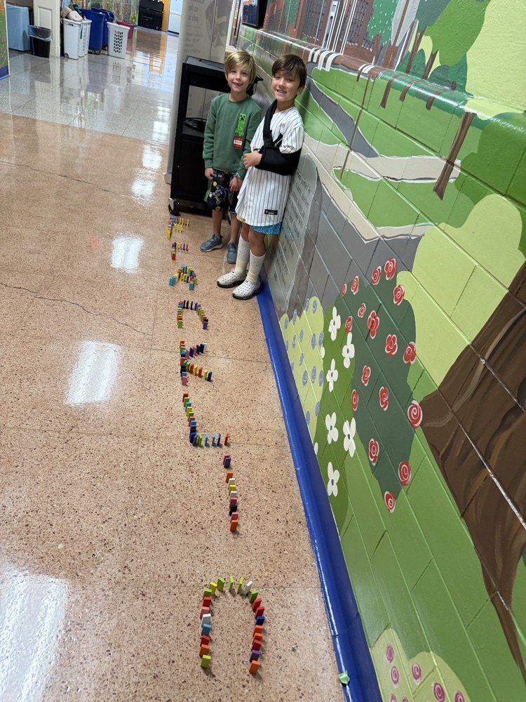 two bots making the name franklin with dominoes 