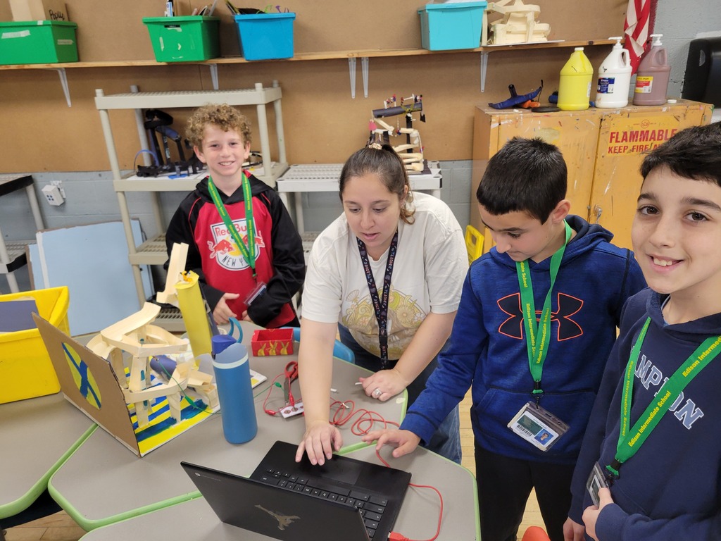 Students working with teacher