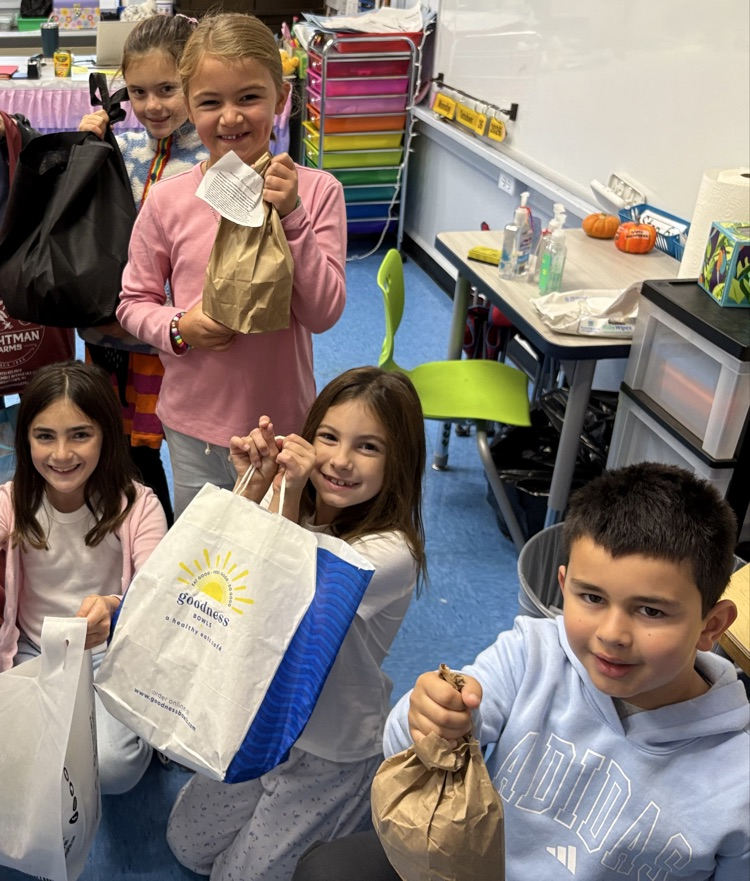 two lunch Tuesday bags with students 