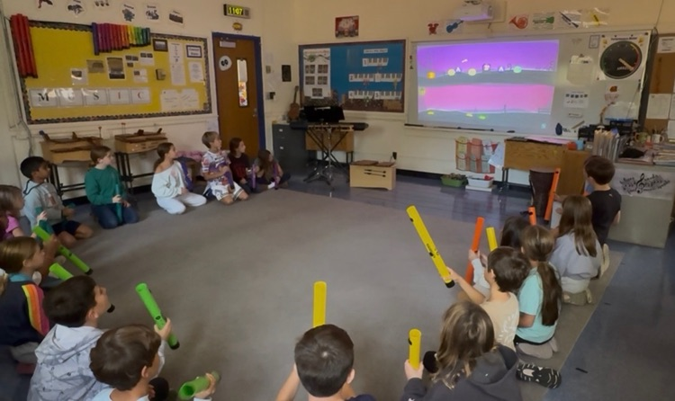 students singing songs abs playing instruments 