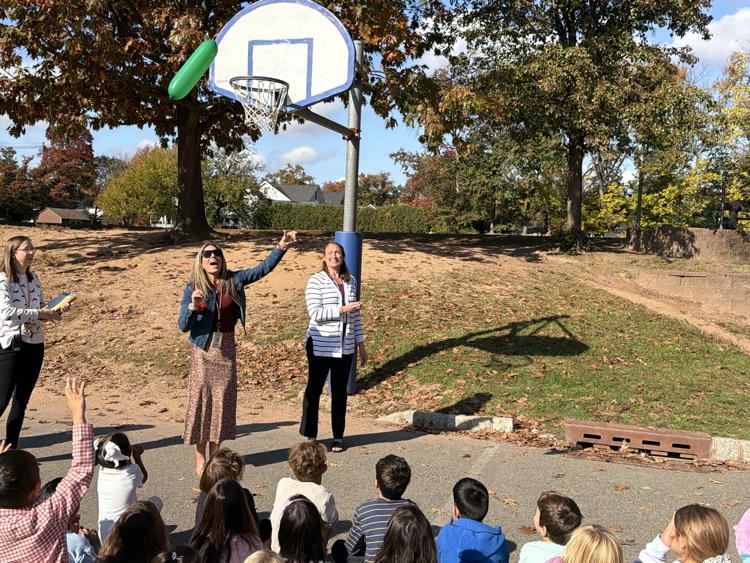 students observing a science lesson on air 