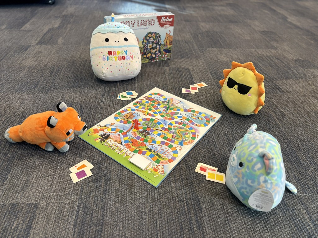 Stuffed friends enjoying a game of Candy Land.
