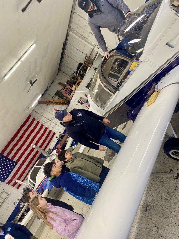 Students working with teacher