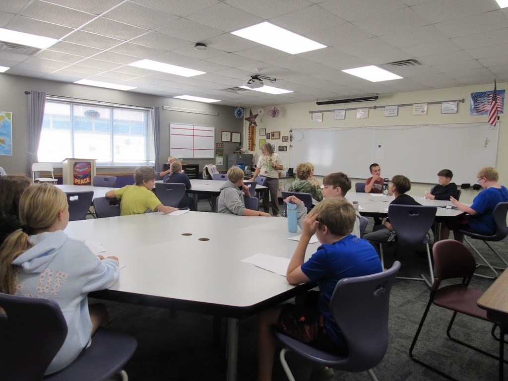 6th graders learning in a classroom