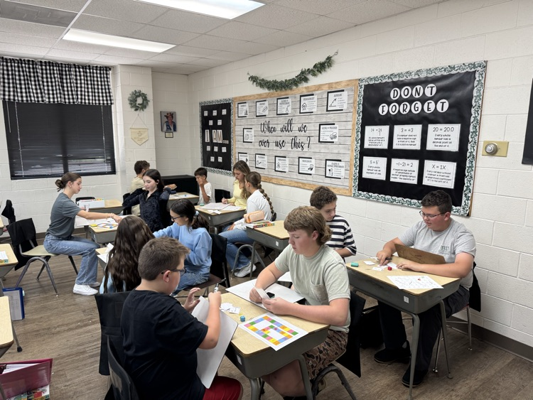 Pre Algebra students are having fun reviewing adding and subtracting positive and negative numbers with a board game!