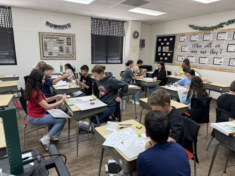 Pre Algebra students are having fun reviewing adding and subtracting positive and negative numbers with a board game!
