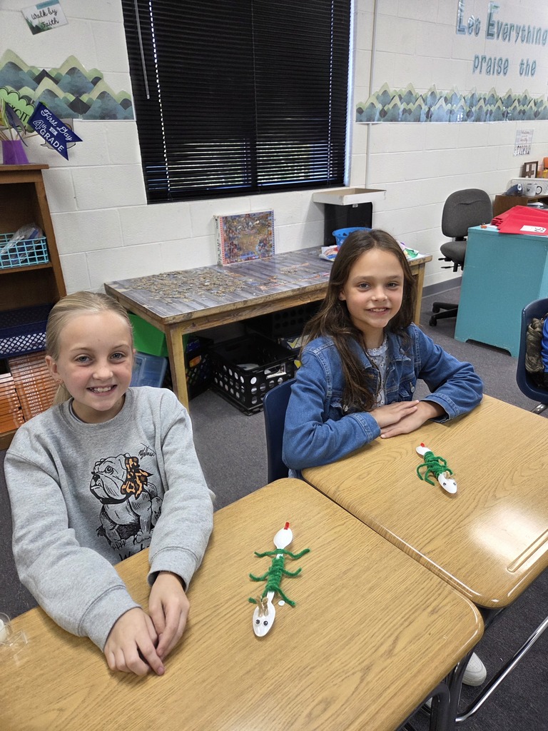 4th graders showing off their arthropods in science.