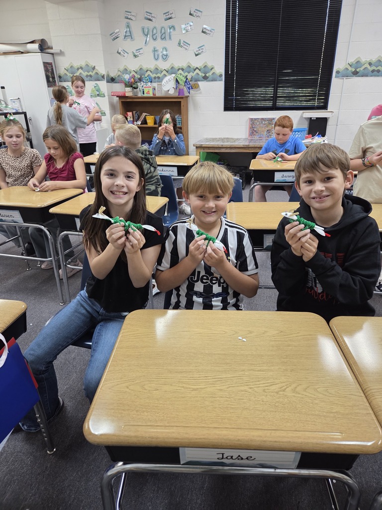 4th graders showing off their arthropods in science.
