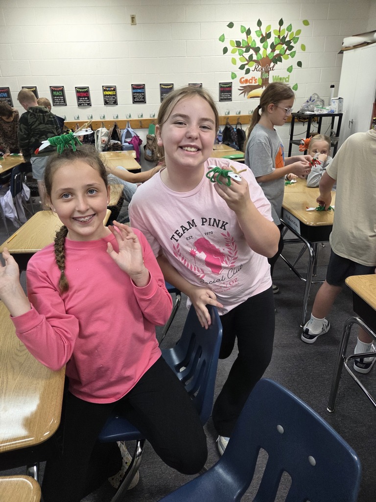 4th graders showing off their arthropods in science.