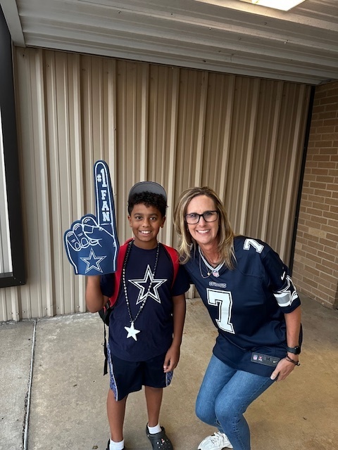 Admin and student in Dallas Cowboy gear