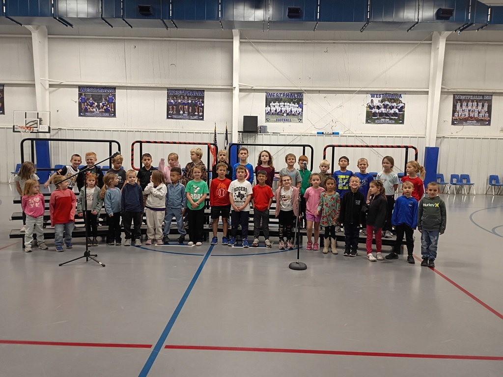 Kinder and 1st Grade practicing in the gym.