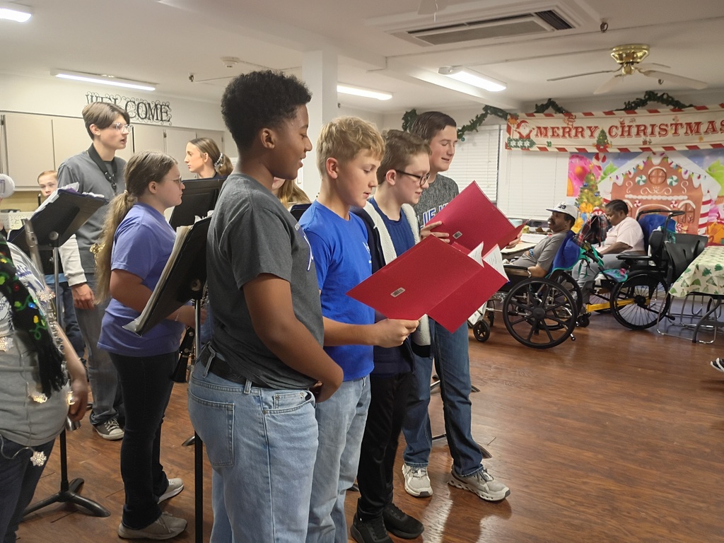 A'King, Cade, Rett, and Jackson singing carols.
