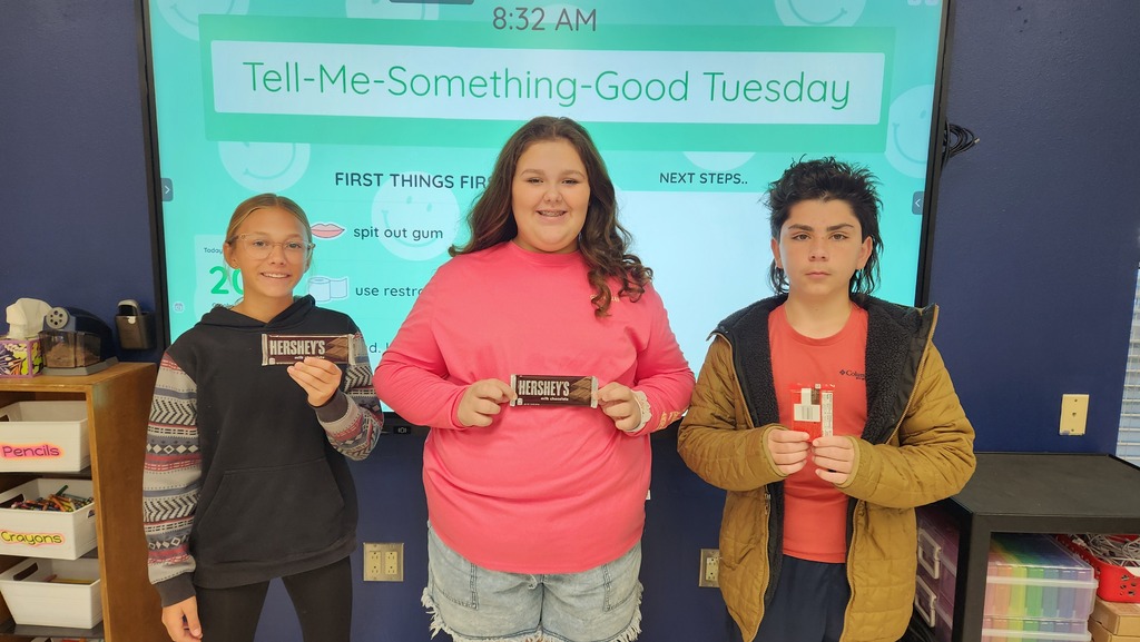 Students pose with prizes earned for winning the classroom keyboarding competition