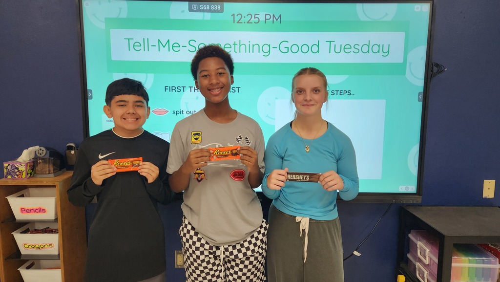 Students pose with prizes earned for winning the classroom keyboarding competition